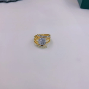 Detail shot of multi-layer golden crisscross ring with micro-pave sparkling crystals