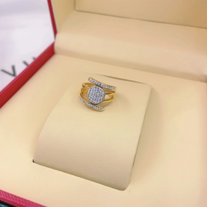 Elegant gold-tone multi-layer wrap ring with pavé-set sparkling zircons in a jewelry box