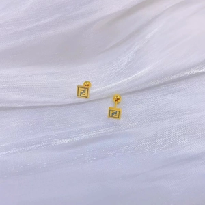 Detailed macro view of 18K gold plated square stud earrings with FF pattern and screw backs