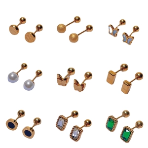 Collection of nine 18K gold-plated titanium steel screw-back earrings with floral designs