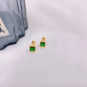 Green square zircon stud earrings with gold plating and ball screw backs on white surface