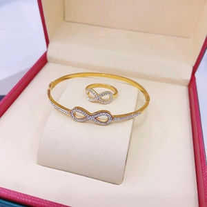 Infinity symbol jewelry set in gold finish with sparkling pavé crystals in a luxury red box