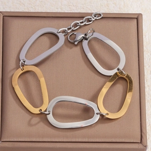 Bracelet à maillons bicolores argent et or avec anneaux ovales géométriques creux