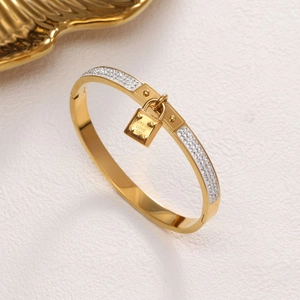 Gouden roestvrijstalen ovale armband met kristallen en Forever Love slot hanger