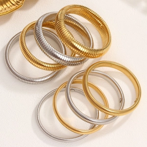 Pulseras Tubogas elásticas de metal en oro y plata con textura de hueso de serpiente