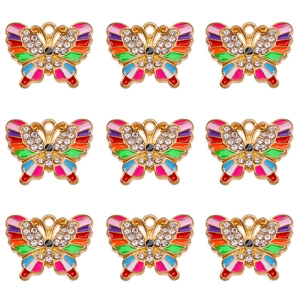 Macro detail of nine colorful enamel butterfly pendants with inlaid white rhinestones