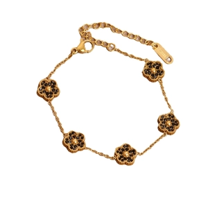 Bracelet en acier inoxydable plaqué or 18k avec cinq breloques fleurs trèfles noires