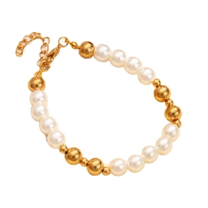 Handmade beaded bracelet with white pearls and gold metal beads on a clean white background