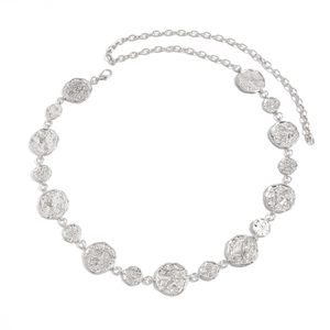 Close-up of silver metal waist chain with irregular textured circles and lobster clasp