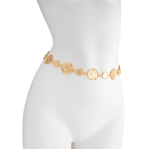 Detail showing irregular hammered gold disc waist belt on white mannequin torso