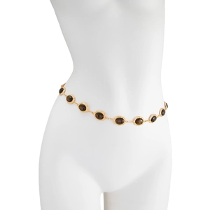 Detailed macro of vintage waist chain featuring tiger eye stones in gold relief settings