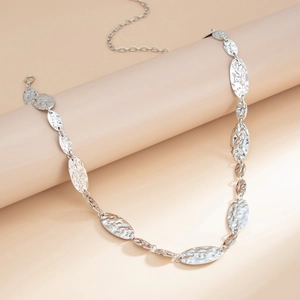Close-up of silver hammered texture oval link chain with adjustable lobster claw clasp