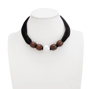 Detail of velvet choker with dark brown wooden beads and a central white pearl bead
