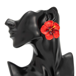 Detail of red hibiscus flower earrings with dripping oil petals and 3D stamens on model