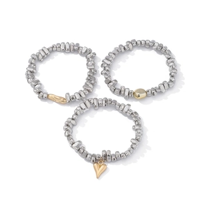 Three-piece silver irregular bead bracelet set with golden heart pendant and metallic accents