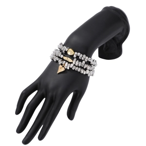 Detail view of triple-layered silver beaded bracelet with a gold heart charm and accents