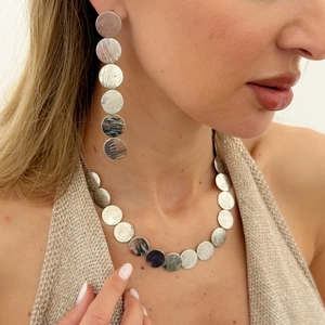 Minimalist silver brushed metal jewelry set with circle disc necklace and drop earrings