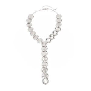 Detail of silver Y-shaped tassel necklace featuring hammered metal discs and adjustable chain