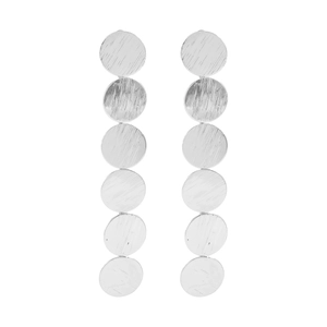 Macro detail of long silver earrings with six brushed metal discs in vertical alignment