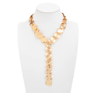 Detail of gold Y-shaped necklace featuring brushed metal sequins and long lariat chain design