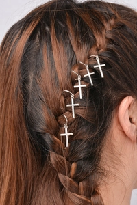 Detail of five silver cross hair rings for braided styles and hip-hop dreadlock decor