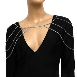 Detail view of sparkly silver layered rhinestone shoulder chain and body tassel jewelry