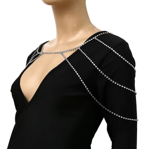 Macro shot of silver multi-layered rhinestone bridal shoulder chain with tassel draping