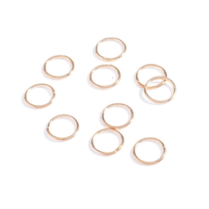 Close-up of golden metal open rings for dreadlocks, African braids and hip-hop hair jewelry