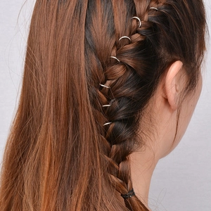 Set of silver metal hair rings for braids featuring leaf and cross charms on hair