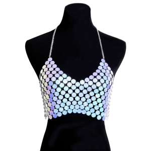Detailed view of iridescent sequin body chain with metallic rings on a black mannequin