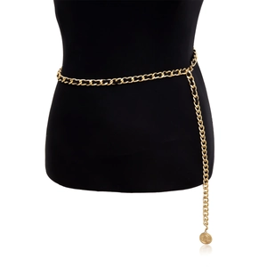 Detail view of multi-layer gold chain body belt featuring vintage coin pendant on black mannequin