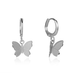 Macro detail of silver butterfly earrings showing fine mesh texture and hoop design