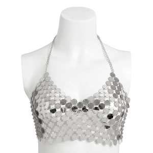Close-up of silver metal discs linked in a scale pattern for this halter body chain