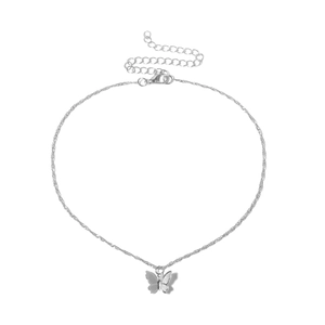 Detailed close-up of a silver butterfly pendant necklace with lobster clasp and chain
