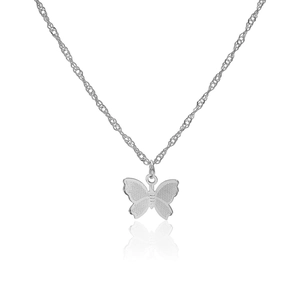Close-up of silver butterfly pendant with textured wings and reflective finish