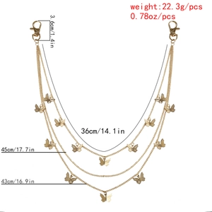 Detail showing triple-layer golden butterfly chain with lobster clasps and sizing details