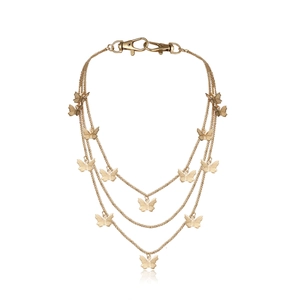 Close-up of gold multi-layer body chain featuring butterfly charms and lobster clasps