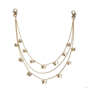 Detail of triple-layer gold butterfly pants chain with secure lobster clasps