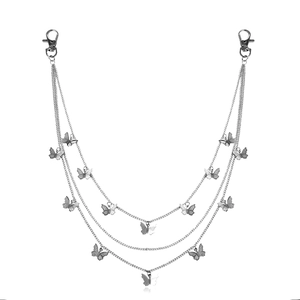 Detail of multi-layer silver body chain featuring hollow butterfly pendants and lobster clasps