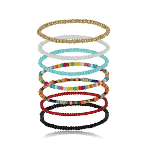 Colorful bohemian style bead bracelet set with gold accents for stylish layered wear