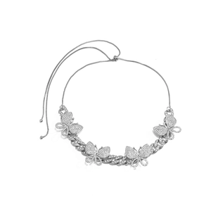 Detail of silver Cuban chain necklace with sparkling rhinestone butterflies and adjustable closure
