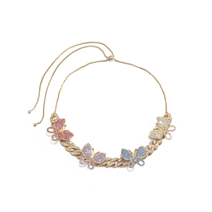 Detail of gold Cuban chain necklace featuring four colorful rhinestone butterflies