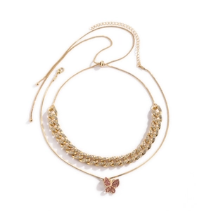 Dolagige Goldkette mit eisgekühlter Cubankette und rosa Schmetterlingsanhänger