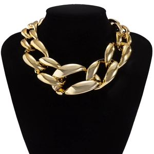Macro view of chunky golden Cuban link chain texture and polished metallic finish
