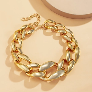 Detail of chunky gold chain necklace with lobster clasp and adjustable extension links