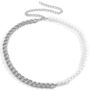 Detail of vintage body chain with silver Cuban links and white faux pearls