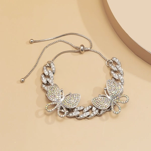 Silver Cuban chain anklet with butterfly charms and colorful crystals detail
