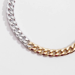 Two-tone gold and silver Cuban link chain necklace with polished finish in punk style