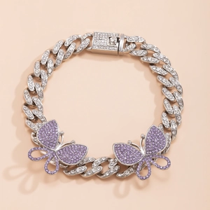 Close-up of Cuban link anklet featuring silver plating and purple rhinestone butterflies