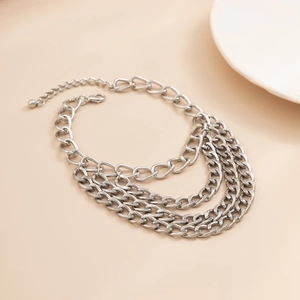 Macro shot of silver multilayered metal chains featuring lobster clasp and extension links